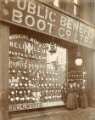 Shop assistants outside Public Benefit Boot Co. Ltd., shoe and boot manufacturers and retailers, Moorhead Shop assistants outside Public Benefit Boot Co. Ltd., shoe and boot manufacturers and retailers, Moorhead