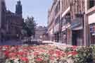 Fargate looking towards Pinstone Street showing (right) No. 16 Cecil Gee, gents outfitters and tailors and No.14 Mappin and Webb Ltd., jewellers