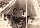 May Mirfin (1901-1994) [former Sheffield ARP ambulance driver and later Sheffield Civil Defence member] carrying out 'gypsy fortune telling' in a tent at a Sheffield Civil Defence Garden Party, c. 1950