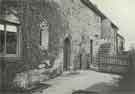Norman doorway, Monk's Smithy houses, [Upper Wortley Road], Thorpe Common, Rotherham, with mural tablet recording the restoration of 1900, [c.1937]