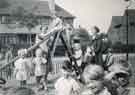 Shiregreen Nursery School, on the chute (slide) with Miss Worley and Miss Lewis
